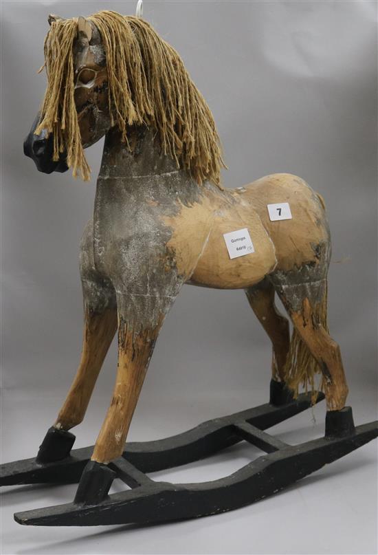 A small wooden rocking horse 61cm
